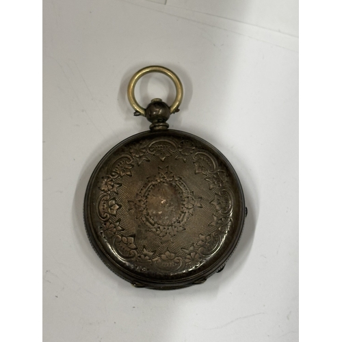 623 - A SILVER FOB WATCH WITH DECORATIVE WHITE ENAMEL WITH ROMAN NUMERALS SEEN WORKING BUT NO WARRANTY GIV... 