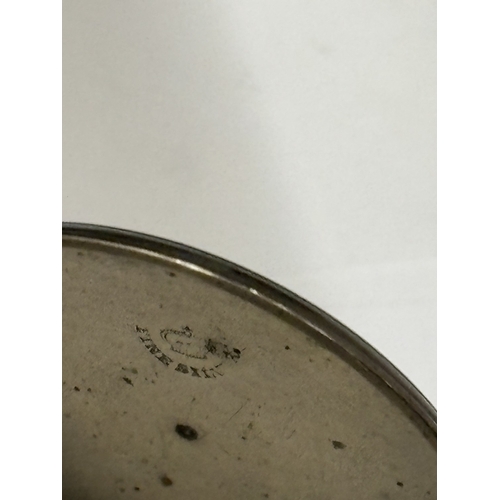 623 - A SILVER FOB WATCH WITH DECORATIVE WHITE ENAMEL WITH ROMAN NUMERALS SEEN WORKING BUT NO WARRANTY GIV... 