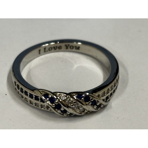 654 - A MARKED 925 CUBIC ZIRCONIA SAPHIRE 'I LOVE YOU' INSCRIBED RING SIZE O IN A PRESNTATION BOX