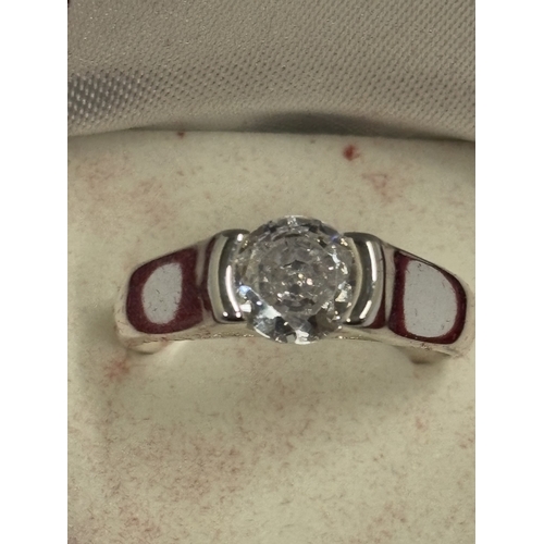 657 - A MARKED 925 CUBIC ZIRCONIA SOLITAIRE RING. SIZE Q. IN A PRESENTATION BOX.