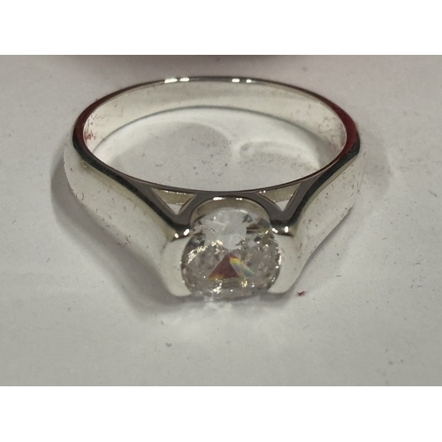 657 - A MARKED 925 CUBIC ZIRCONIA SOLITAIRE RING. SIZE Q. IN A PRESENTATION BOX.