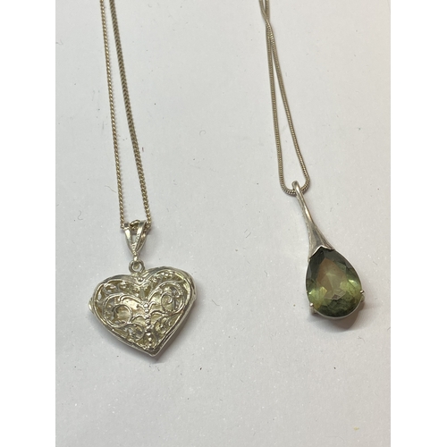 709 - FOUR SILVER NECKLACES WITH PENDANTS