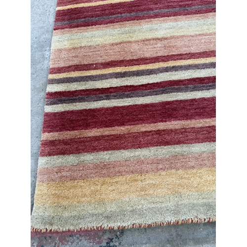 2499 - A LAURA ASHLEY MULTI COLOURED RUG 177 CM X 124 CM
