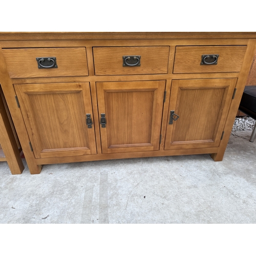 2518 - AN OAK SIDEBOARD ENCLOSING THREE DRAWERS AND THREE CUPBOARDS, 55