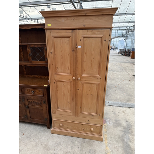 2535 - A PINE TWO DOOR WARDROBE WITH DRAWER TO BASE, 37