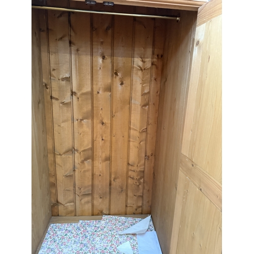 2535 - A PINE TWO DOOR WARDROBE WITH DRAWER TO BASE, 37