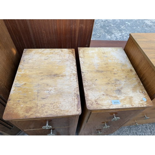 2579 - A PAIR OF MID 20TH CENTURY WALNUT BEDSIDE CHESTS