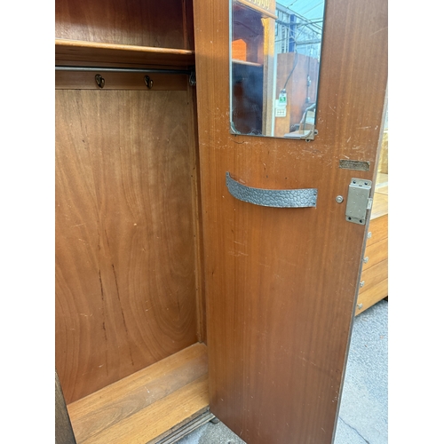 2580 - A MID 20TH CENTURY OAK HALL WARDROBE WITH LINEN FOLD DOOR AND INTERNAL MIRROR, 37.5