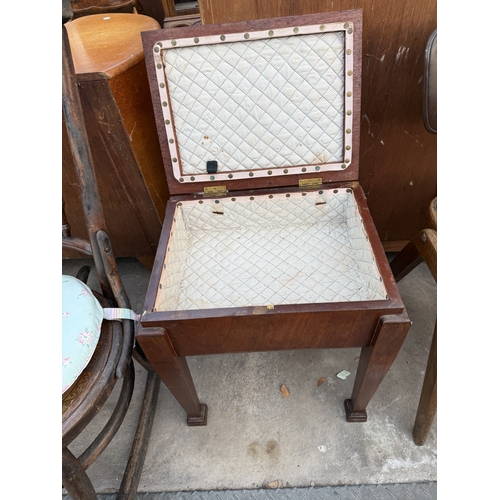 2590 - AN EDWARDIAN MAHOGANY SEWING BOX/STOOL ON TAPERING LEGS