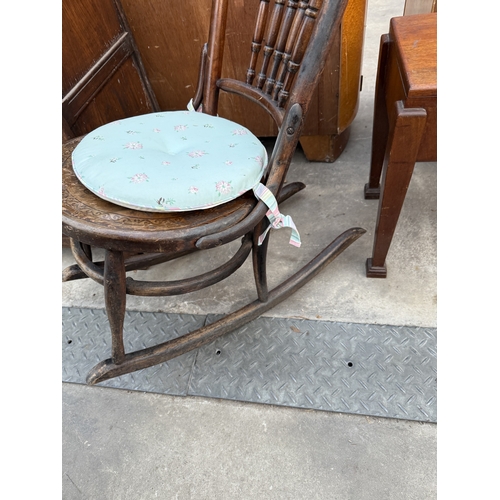 2591 - A BENTWOOD ROCKING CHAIR WITH SPINDLE BACK