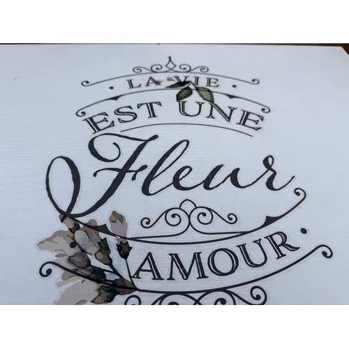 2594 - A WHITE PAINTED DROP LEAF TABLE, THE TOP WITH LETTERING 'LA VIE EST UNE FLEUE AMOUR'