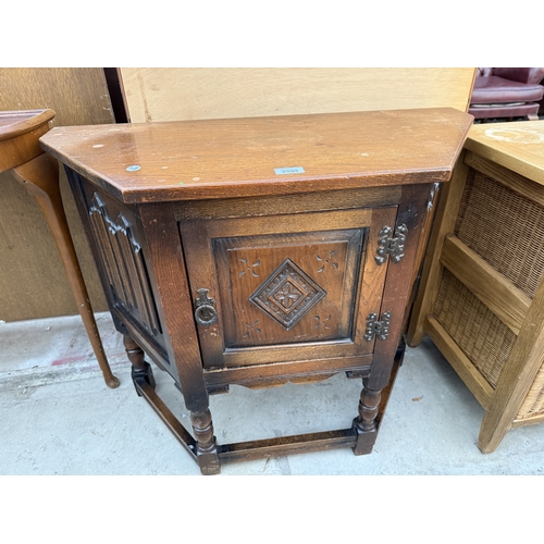 2599 - AN OLD CHARM JACOBEAN STYLE SIDE CABINET WTIH LINEN FOLD PANELS, CANTED CORNES, SINGLE CUPBOARD, 32