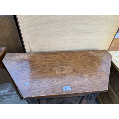 2599 - AN OLD CHARM JACOBEAN STYLE SIDE CABINET WTIH LINEN FOLD PANELS, CANTED CORNES, SINGLE CUPBOARD, 32