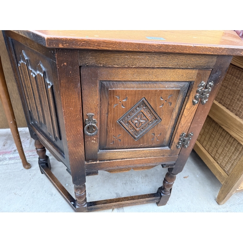 2599 - AN OLD CHARM JACOBEAN STYLE SIDE CABINET WTIH LINEN FOLD PANELS, CANTED CORNES, SINGLE CUPBOARD, 32