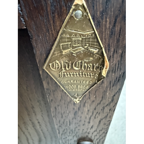 2599 - AN OLD CHARM JACOBEAN STYLE SIDE CABINET WTIH LINEN FOLD PANELS, CANTED CORNES, SINGLE CUPBOARD, 32