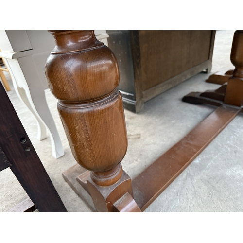 2633 - A MID 20TH CENTURY OAK TWIN PEDESTAL DRAW LEAF DINING TABLE