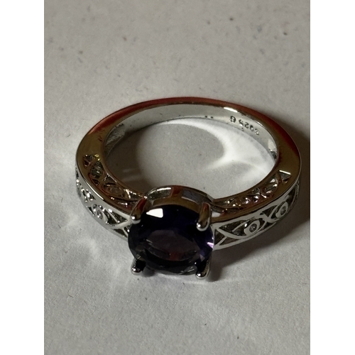 600 - A MARKED 925 PURPLE STONE AND CUBIC ZIRCONIA RING SIZE N IN A PRESENTATION BOX