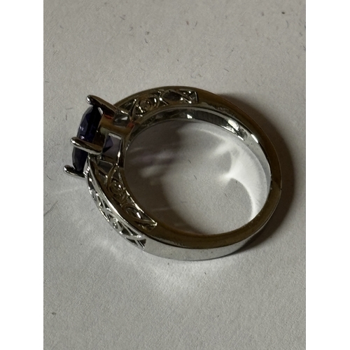 600 - A MARKED 925 PURPLE STONE AND CUBIC ZIRCONIA RING SIZE N IN A PRESENTATION BOX
