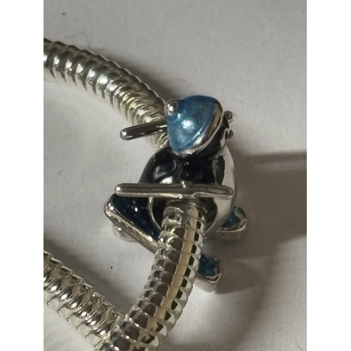 610 - A MARKED 925 CHARM BRACLET WITH CHRISTMAS PENGUIN CHARM IN A PRESENTATION BOX