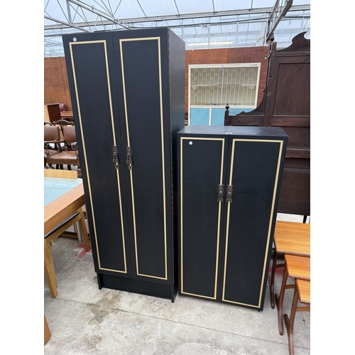 2759 - A BLACK AND GOLD PAINTED TWO DOOR WARDROBE AND MATCHING SMALLER WARDROBE