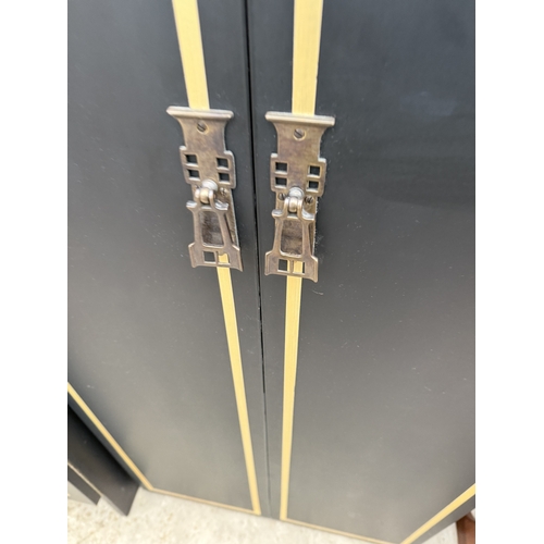 2759 - A BLACK AND GOLD PAINTED TWO DOOR WARDROBE AND MATCHING SMALLER WARDROBE