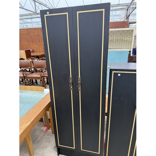 2759 - A BLACK AND GOLD PAINTED TWO DOOR WARDROBE AND MATCHING SMALLER WARDROBE