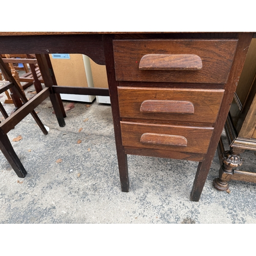 2745 - A MID 20TH CENTURY OAK SINGLE PEDESTAL DESK ENCLOSING THREE DRAWERS, 39