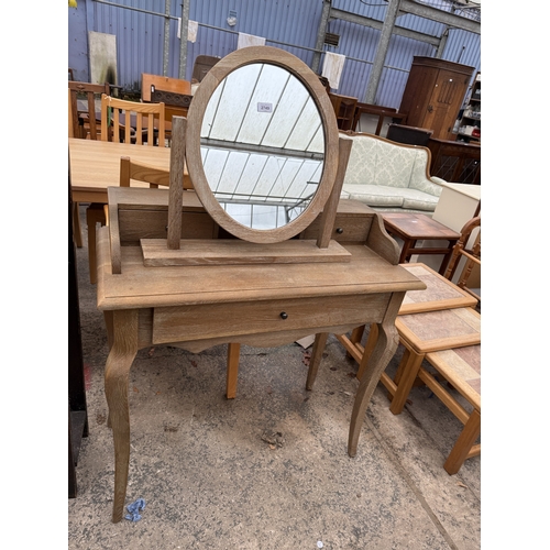 2749 - A LIMED OAK DRESSING TABLE WITH SWING FRAME MIRROR, 35