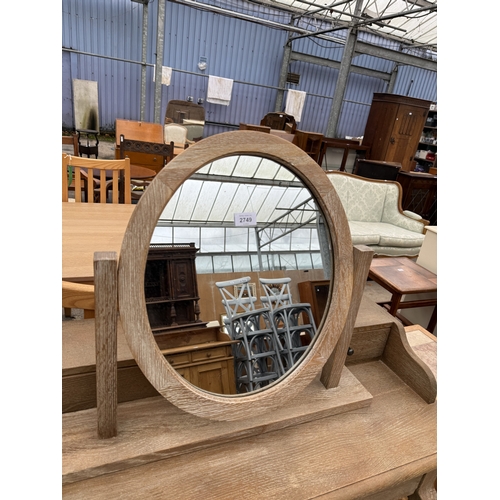 2749 - A LIMED OAK DRESSING TABLE WITH SWING FRAME MIRROR, 35