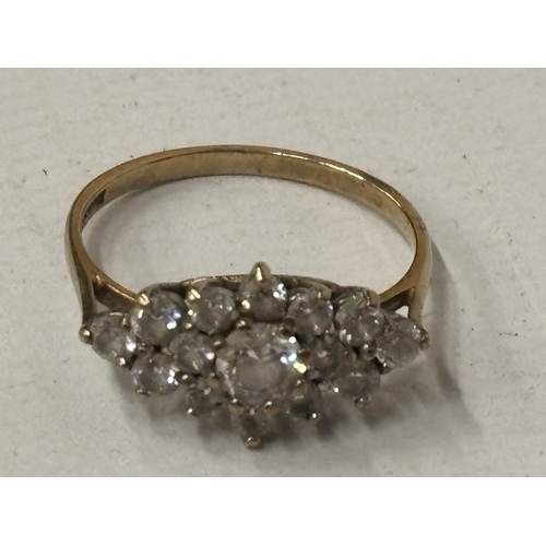 520 - A 9 CARAT GOLD CUBIC ZIRCONIA CLUSTER RING SIZE N/O GROSS WEIGHT 2.09 GRAMS