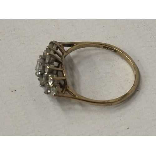 520 - A 9 CARAT GOLD CUBIC ZIRCONIA CLUSTER RING SIZE N/O GROSS WEIGHT 2.09 GRAMS