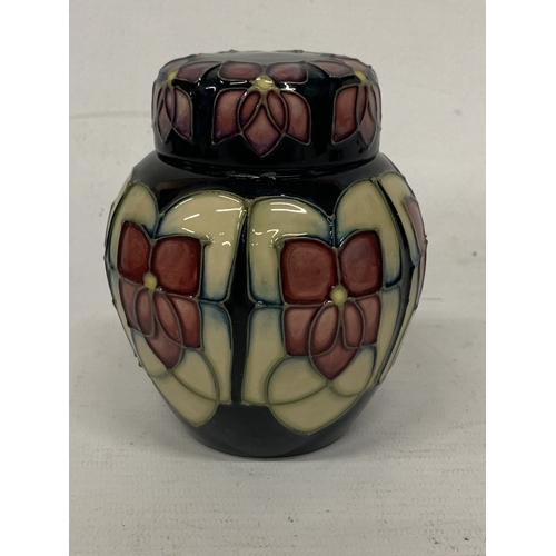 414 - A MOORCROFT VIOLET PATTERN GINGER JAR WITH COVER, HEIGHT 11CM