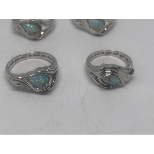 635 - FOUR SILVER AND OPAL RINGS GROSS WEIGHT 16.62 GRAMS