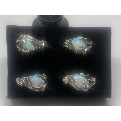 635 - FOUR SILVER AND OPAL RINGS GROSS WEIGHT 16.62 GRAMS