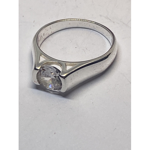 641 - A MARKED 925 CLEAR STONE SOLITAIRE RING IN A HEART SHAPED PRESENTATION BOX