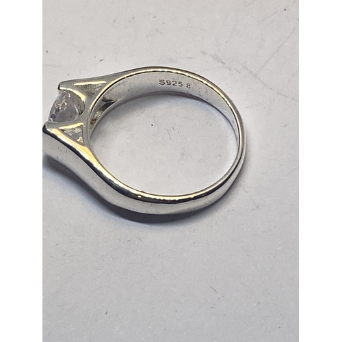 641 - A MARKED 925 CLEAR STONE SOLITAIRE RING IN A HEART SHAPED PRESENTATION BOX