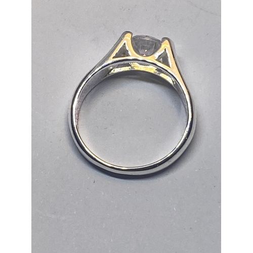 641 - A MARKED 925 CLEAR STONE SOLITAIRE RING IN A HEART SHAPED PRESENTATION BOX