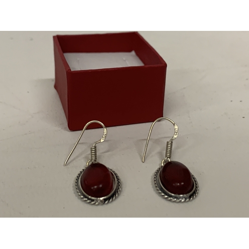 646 - A PAIR OF MARKED 925 GARNET EARRINGS IN A PRESENTATION BOX