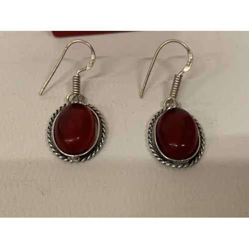 646 - A PAIR OF MARKED 925 GARNET EARRINGS IN A PRESENTATION BOX