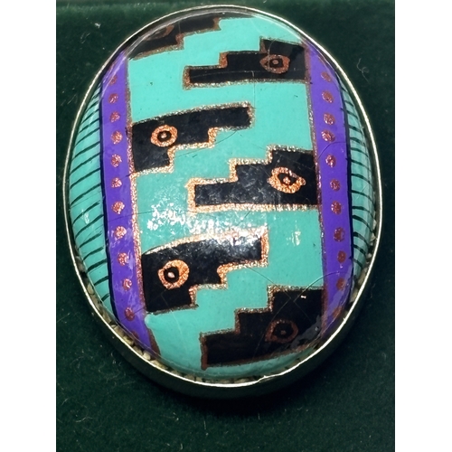 653 - A PAIR OF SILVER AND ENAMEL EARRINGS IN A PRESENTATION BOX