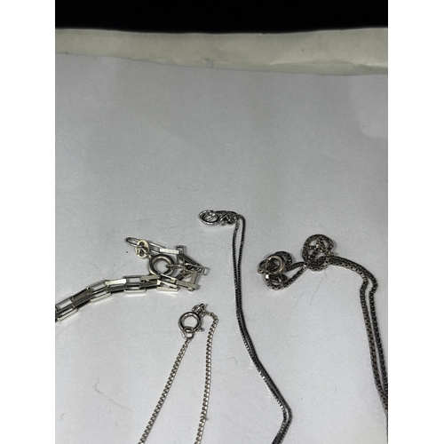 655 - FOUR SILVER NECKLACES WITH PENDANTS GROSS WEIGHT 12.35 GRAMS