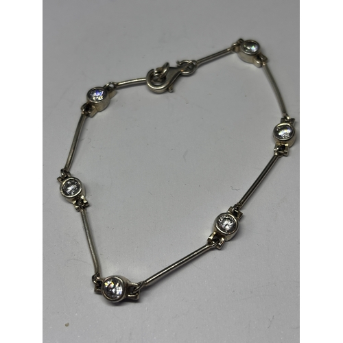 677 - TWO SILVER BRACELETS WITH CLEAR STONES GROSS WEIGHT 12.31 GRAMS