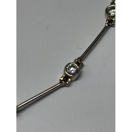 677 - TWO SILVER BRACELETS WITH CLEAR STONES GROSS WEIGHT 12.31 GRAMS