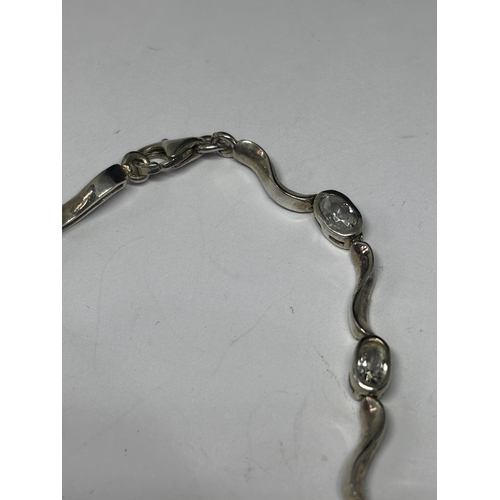 677 - TWO SILVER BRACELETS WITH CLEAR STONES GROSS WEIGHT 12.31 GRAMS