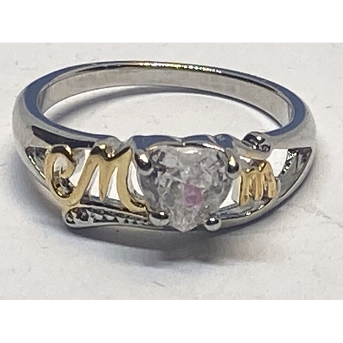 695 - A MARKED 925 MUM RING WITH HEART SHAPED CENTRE CLEARSTONE IN A PRESENTATION BOX