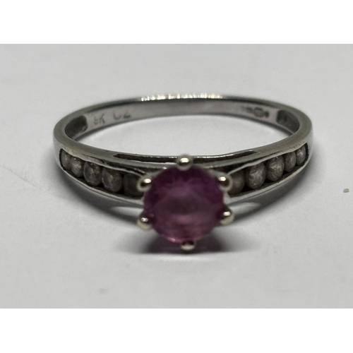 545 - A MARKED 9 CARAT WHITE GOLD RING WITH PINK STONE AND CUBIC ZIRCONIAS TO THE SHOULDERS SIZE I/J GROSS... 