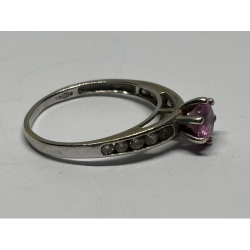 545 - A MARKED 9 CARAT WHITE GOLD RING WITH PINK STONE AND CUBIC ZIRCONIAS TO THE SHOULDERS SIZE I/J GROSS... 