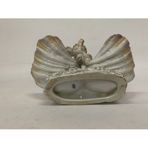 13 - AN EARLY 20TH CENTURY GERMAN PORCELAIN FIGURE OF A SHELL ANGEL WITH WINGS