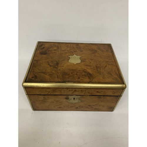 14 - A BURR WALNUT WRITING SLOPE WITH SECRET DRAWER AND BRASS BANDING