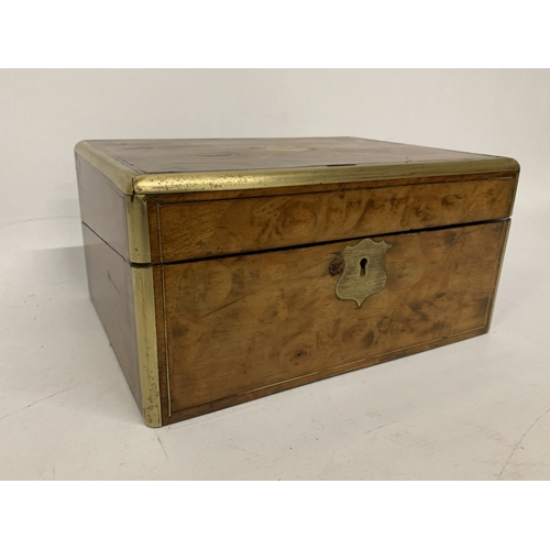 14 - A BURR WALNUT WRITING SLOPE WITH SECRET DRAWER AND BRASS BANDING